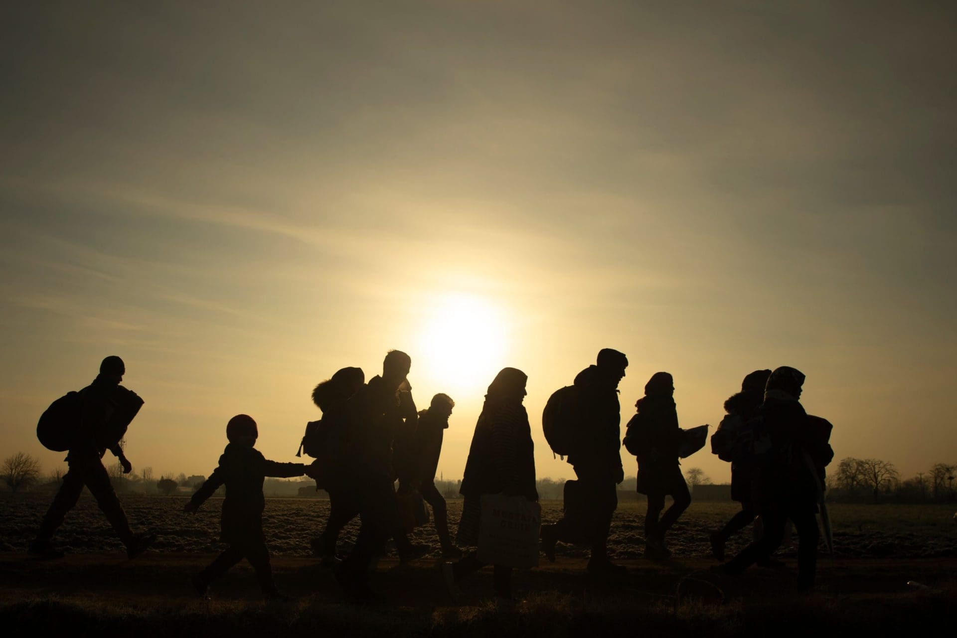 Migrants walk towards the Pazarkule–Kastanies Border Crossing between Türkiye and Greece