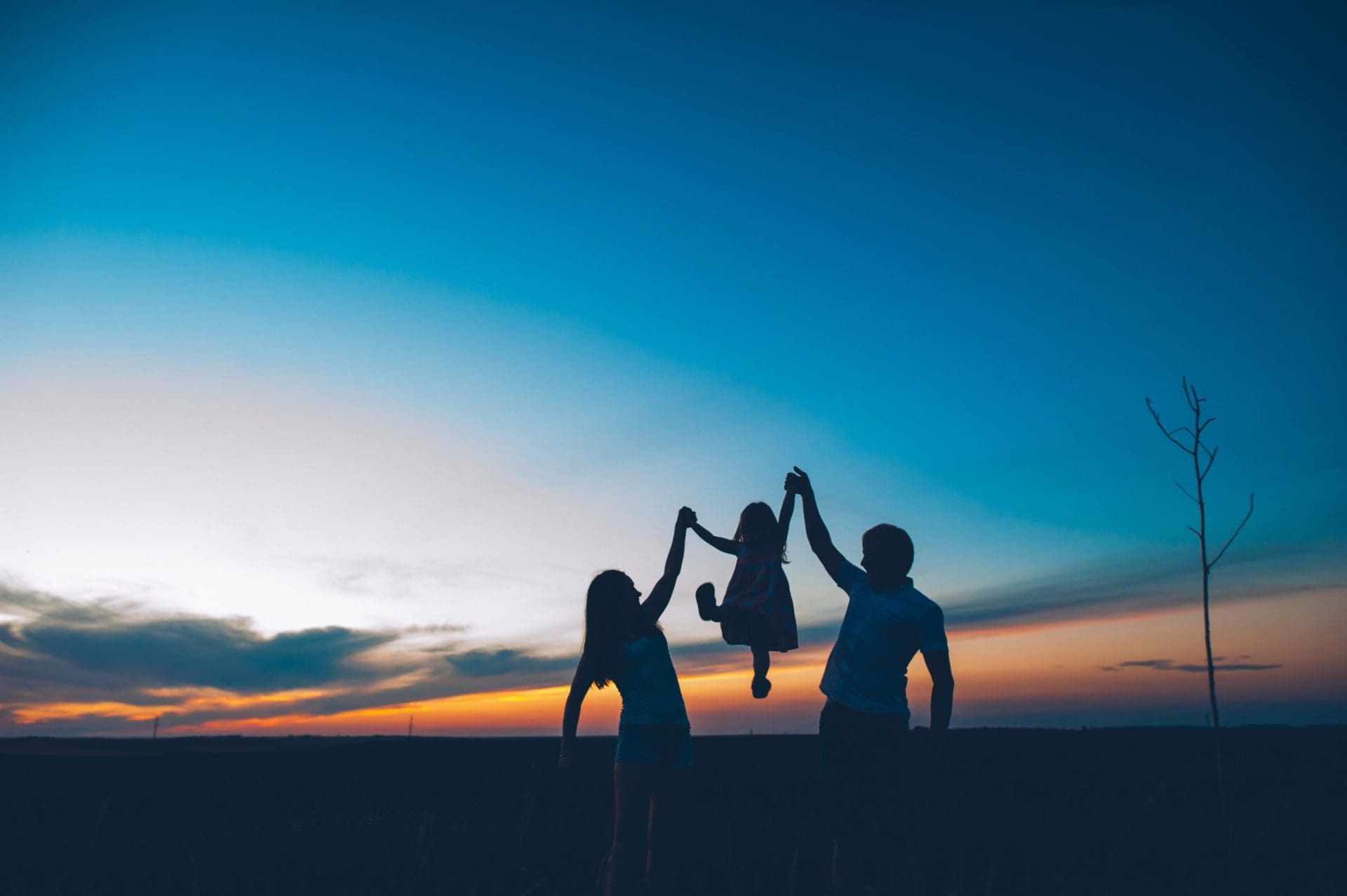 Happy,Family,Together,,Parents,With,Their,Little,Child,At,Sunset.