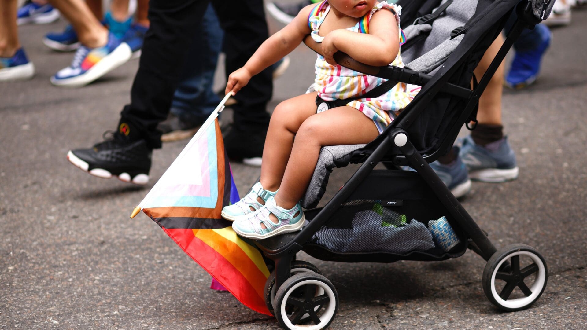 A baby holds a rainbow flag during the Annual New York Pride March on June 25, 2023 in New York City. (Photo by Kena Betancur / AFP)