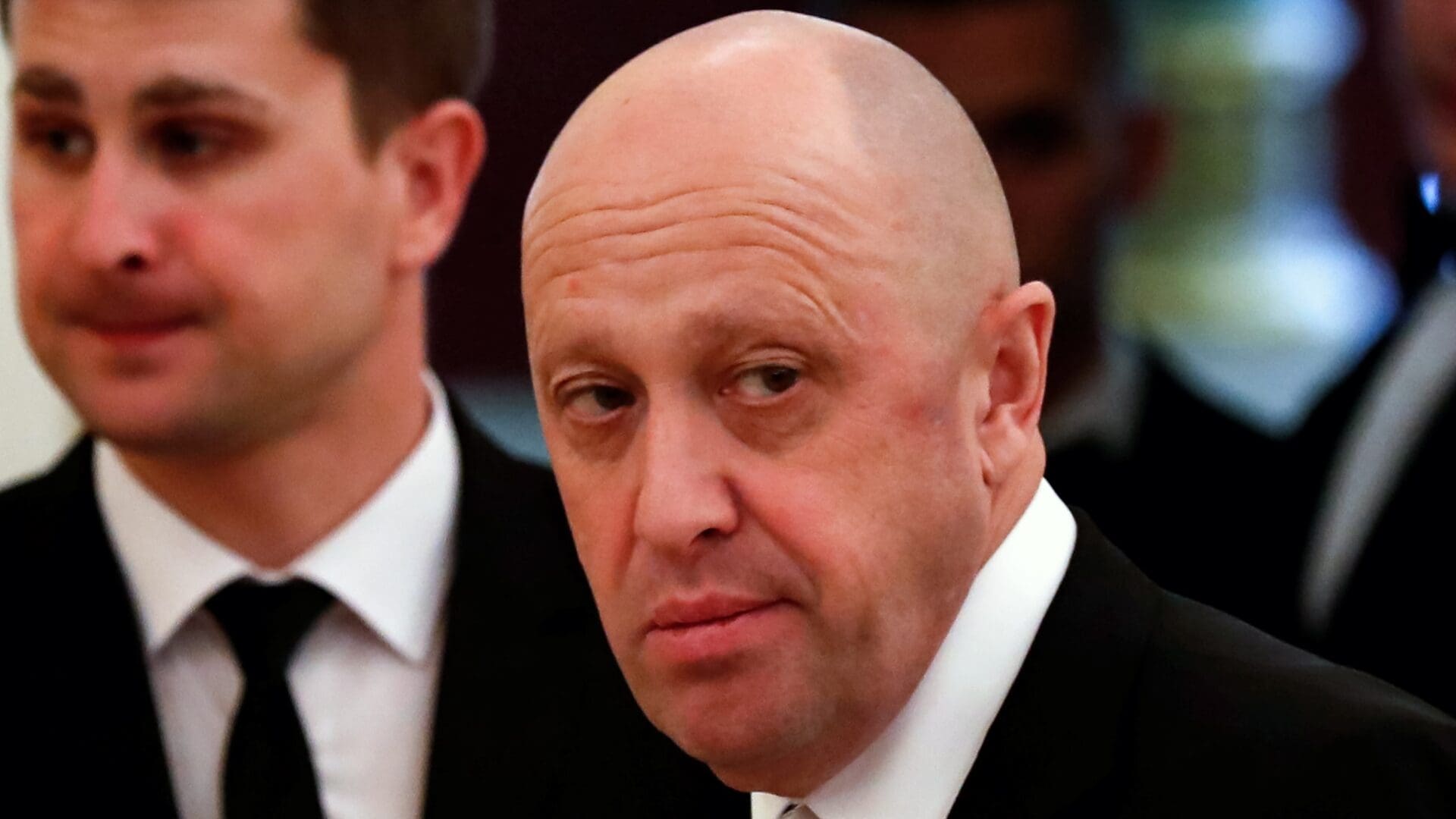 This picture taken on July 4, 2017 shows Russian businessman Yevgeny Prigozhin prior to a meeting with business leaders held by Russian and Chinese presidents at the Kremlin in Moscow. (Photo by Sergei ILNITSKY / POOL / AFP)