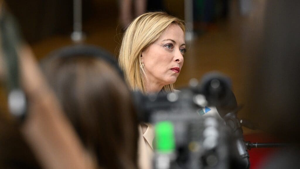 Giorgia Meloni interacting with the press ahead of the European Council summit on 29 June 2023 in Brussels.