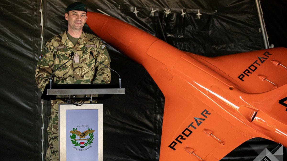 Brigadier General Imre Porkoláb speaking at the presentation event, standing next to a ProTAR.