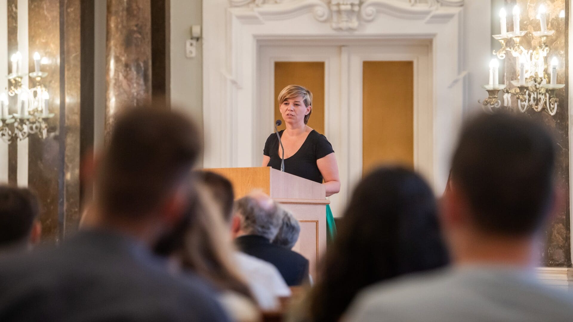 Veronika Varga-Bajusz delivers her remarks at the opening of the summer university in Budapest on 26 July 2023.