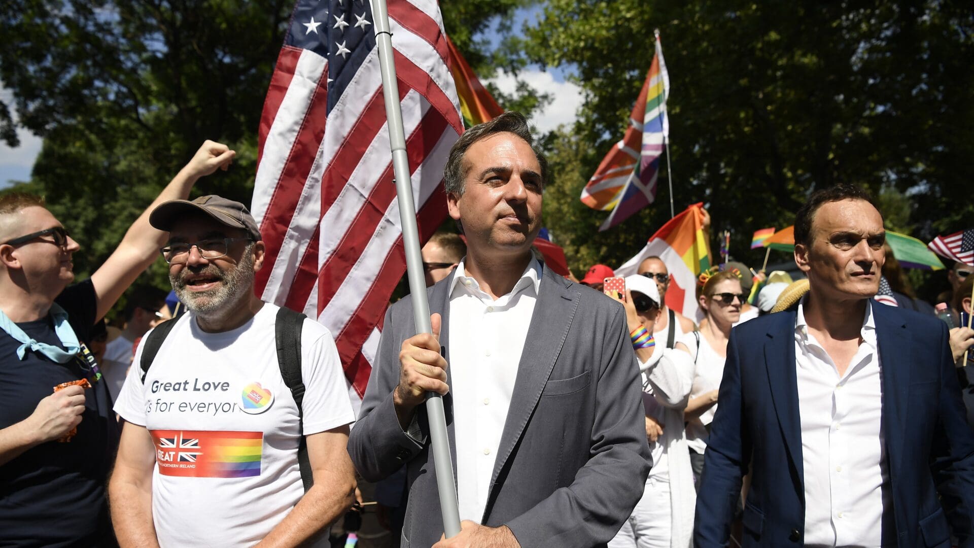 US Ambassador David Pressman marching with his country's flag at the Budapest Pride event on 15 July 2023.