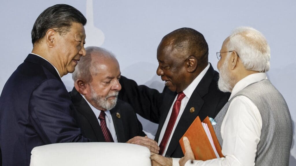 (From L to R) President of China Xi Jinping, President of Brazil Luiz Inacio Lula da Silva, South African President Cyril Ramaphosa and Prime Minister of India Narendra Modi gesture during the 2023 BRICS Summit at the Sandton Convention Centre in Johannesburg on August 24, 2023. (Photo by Marco Longari / AFP)