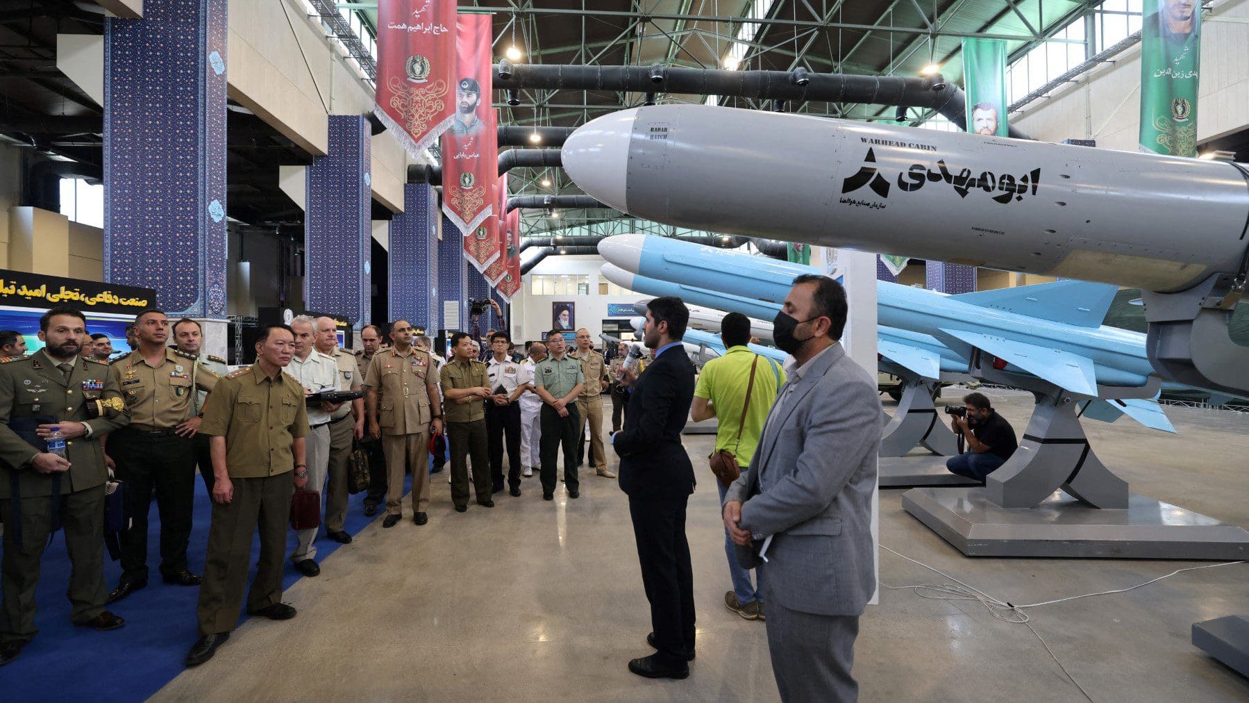 Foreign military advisors visit Iran's defence industry achievements exhibition in Tehran on August 23, 2023. Iran unveiled on August 22 its latest domestically built drone that can fly at a higher altitude and for a longer duration with enhanced weapons capabilities, state media reported. (Photo by ATTA KENARE / AFP)