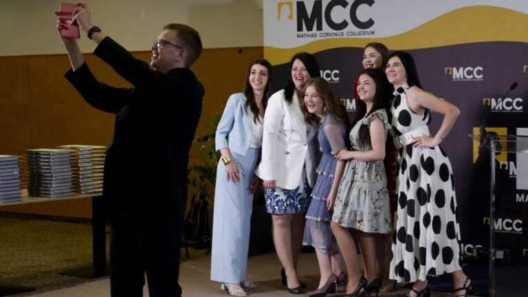 Graduates of the postgraduate programmes of MCC taking a selfie at the graduation ceremony in Budapest on 28 May 2022.