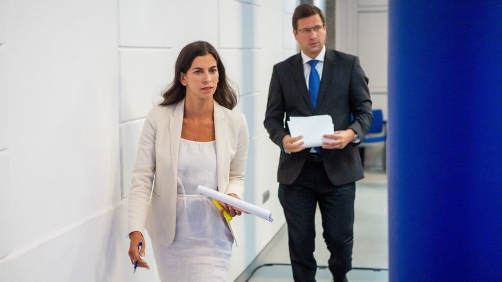 Government spokesperson Alexandra Szentkirályi and Chief of the PM's Office Gergely Gulyás on their way to the government press briefing on 13 September 2023.