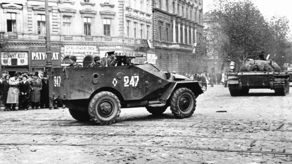 Budapesters look on as Soviet troops temporarily pull out of Budapest on 31 October 1956.