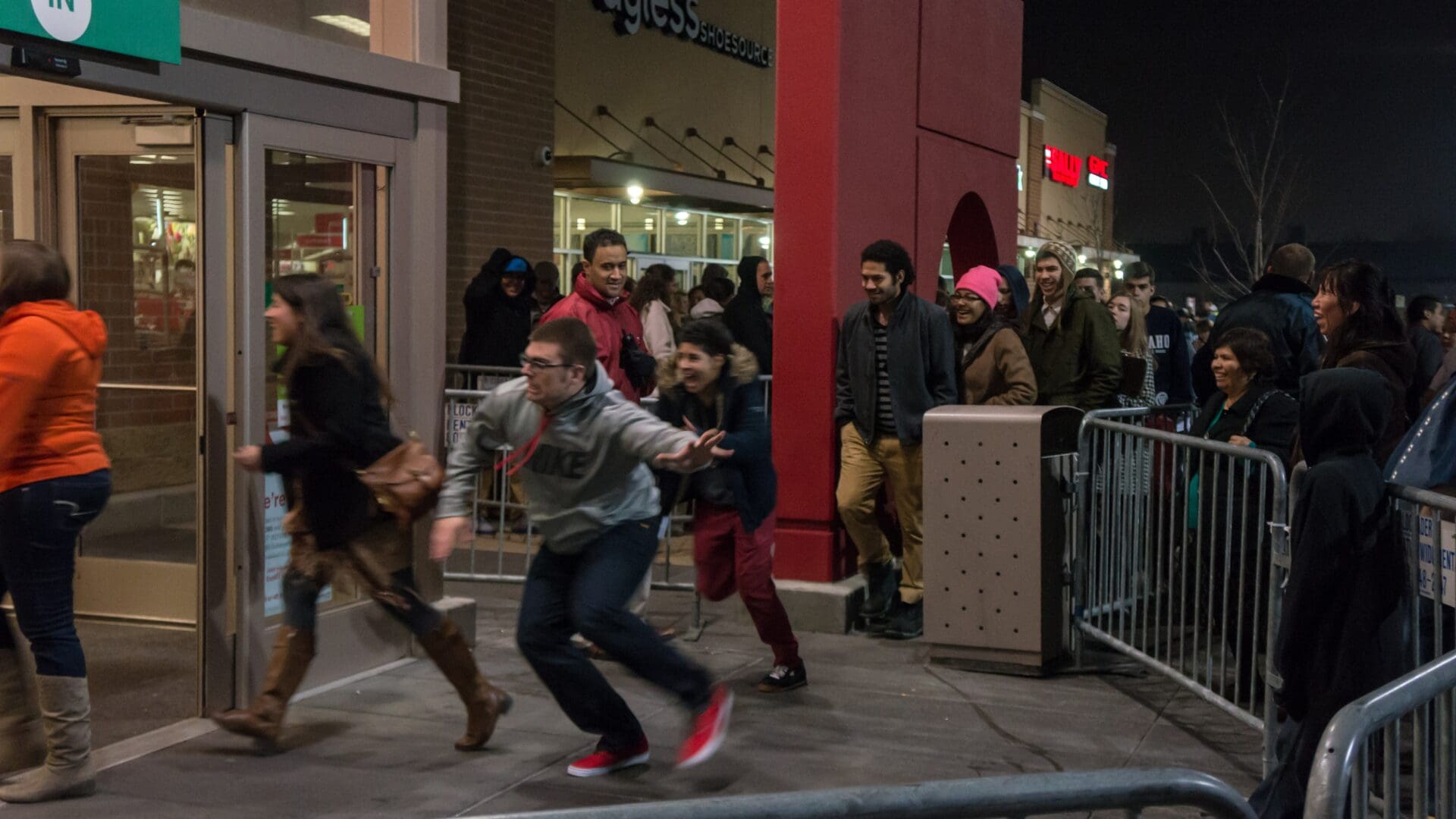 Shoppers rush into a store in Laramie, Wyoming as it opens on Black Friday in 2013.