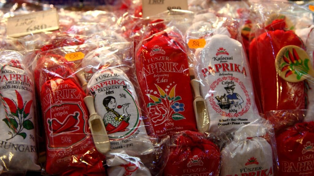 Sacks of various paprika products on display in a Hungarian shop.
