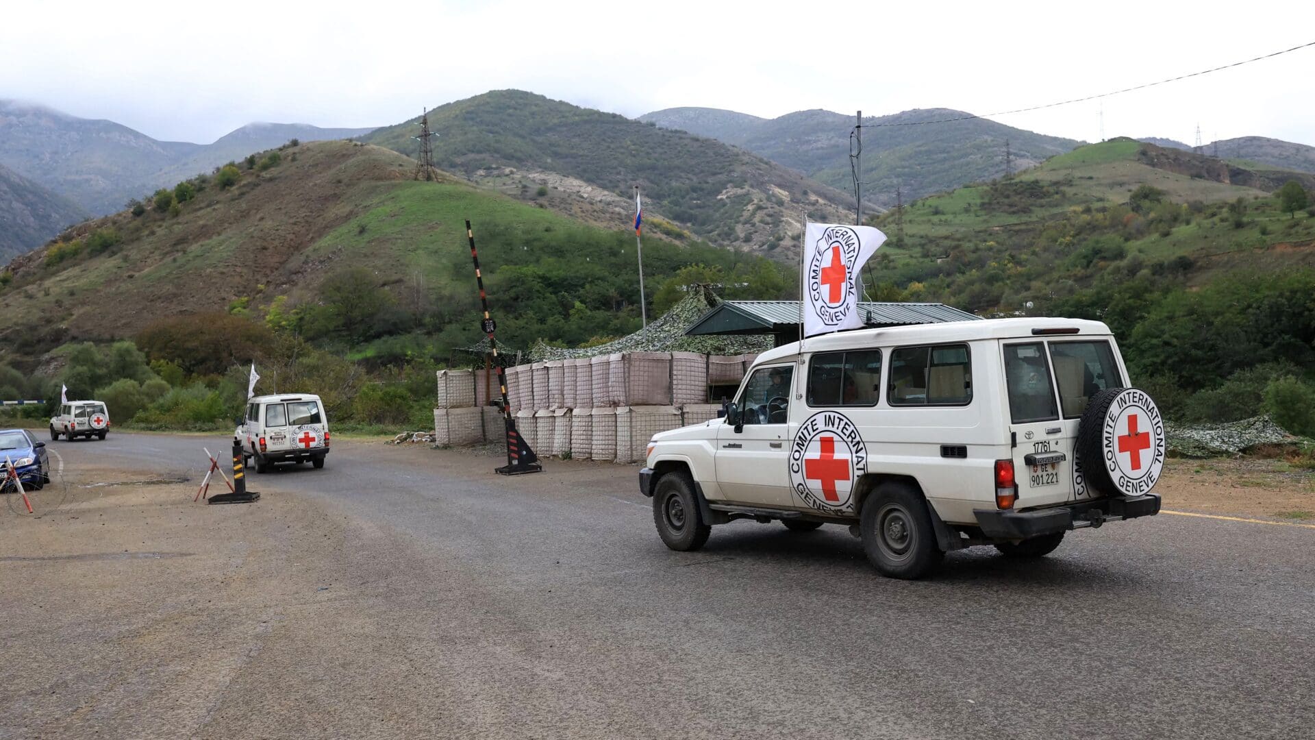 A convoy of the International Committee of the Red Cross (ICRC) makes its way past a checkpoint of Russian peacekeepers in Azerbaijan's controlled region of Nagorno-Karabakh