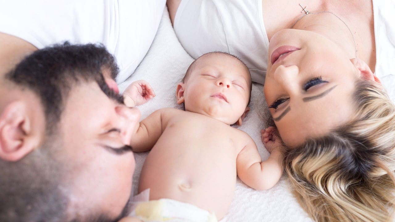 Young couple with newborn baby/Pixabay