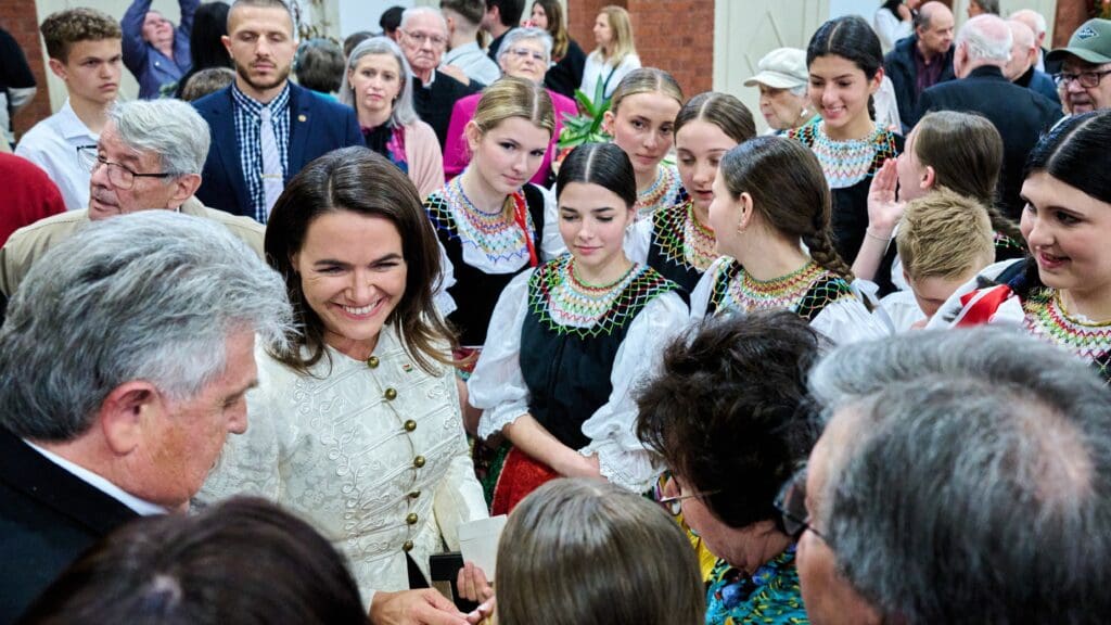 President Katalin Novák surrounded by Hungarian Australian youth wearing folk costumes at the Hungarian Centre in Melbourne, Australia on 22 October 2023.