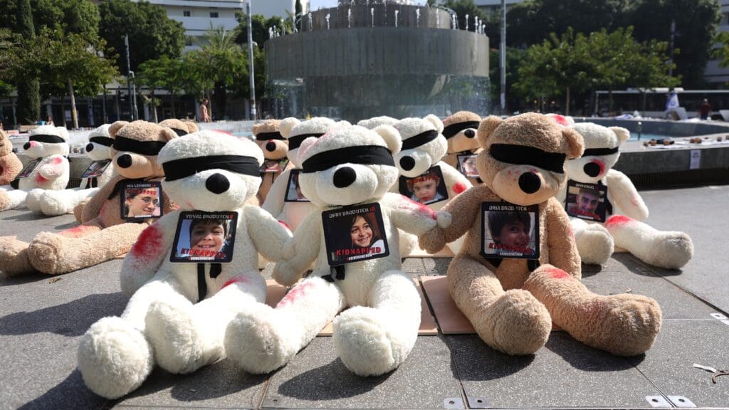 Blindfolded teddy bears with the photos and names of the Israeli children kidnapped by Hamas terrorists displayed on Tel Aviv’s Dizengoff Square on 25 October 2023.
