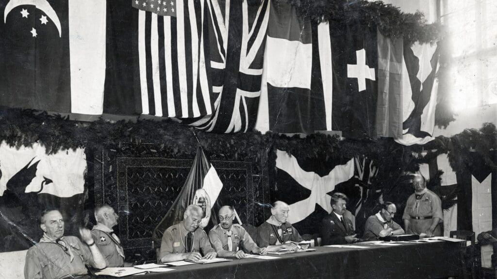 Pál Teleki (C, wearing glasses) sitting to the left of Robert Baden-Powell, the founder of the Scout Movement, at the 4th World Scout Jamboree in Gödöllő in 1933.
