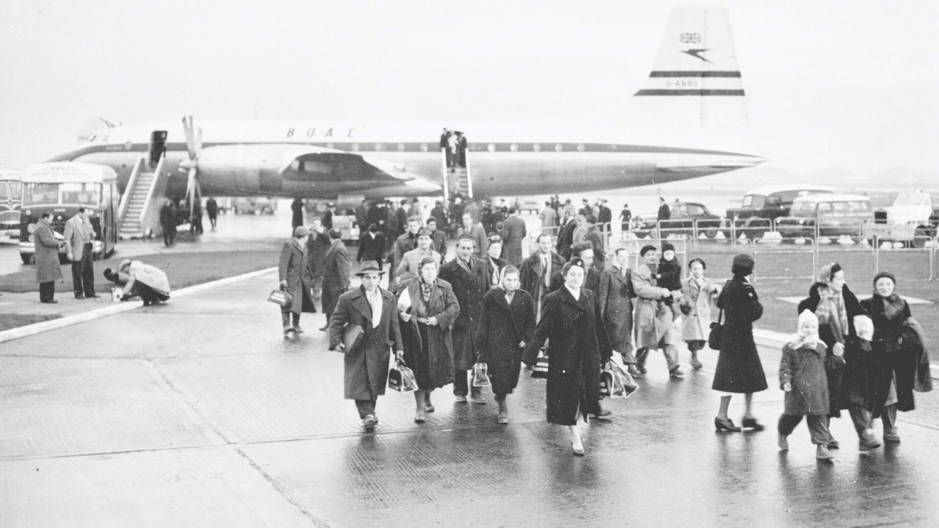 A group of (probably) Hungarian refugees arrive at Croydon Airport on 21 December 1956.