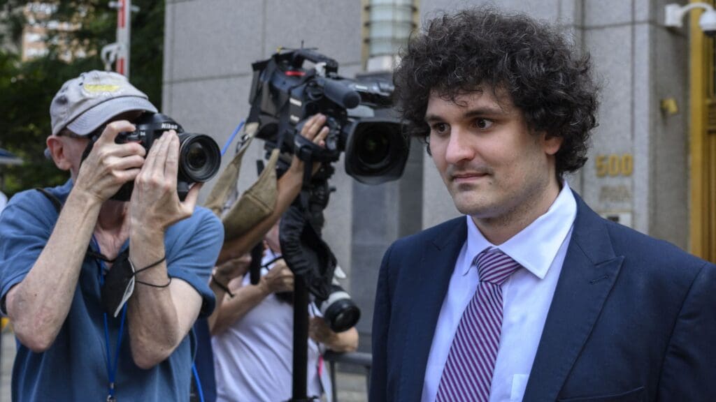 Former FTX chief Sam Bankman-Fried leaves the Federal Courthouse following a bail hearing ahead of his October trial, in New York City on 26 July 2023.