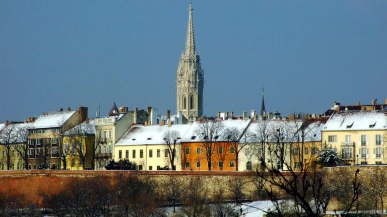 The Castle District in winter, with the steeple of the Matthias Church in the background, viewed from the Tabán.