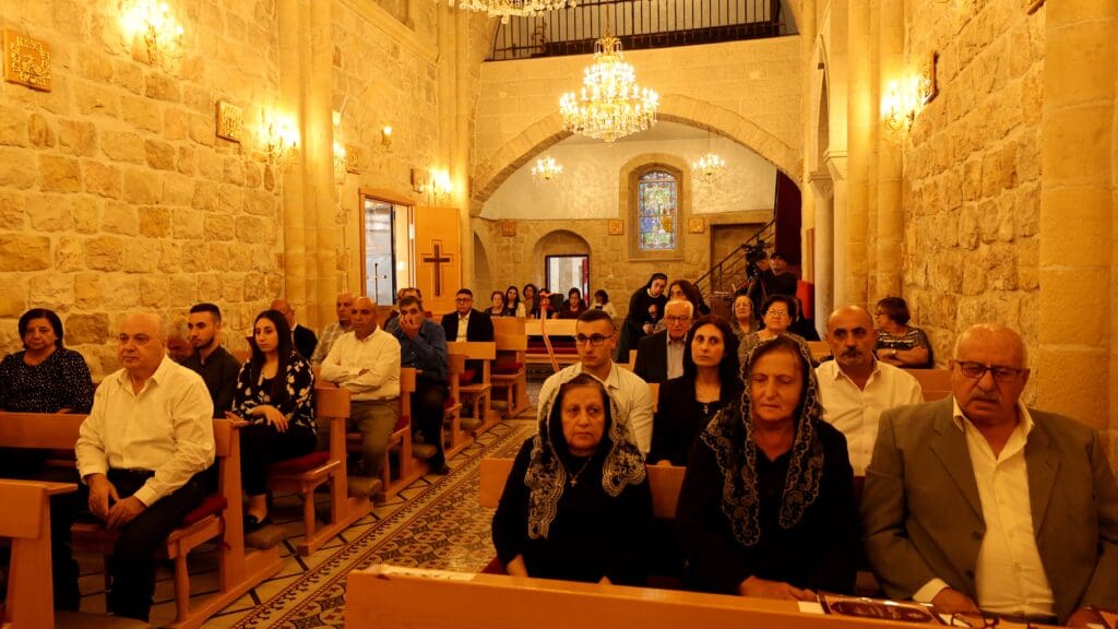 Palestinian Christians attend mass in the village of Jifna, north of Ramallah on 23 October for those killed during a strike on the St Porphyrius church in Gaza City on 20 October 2023.