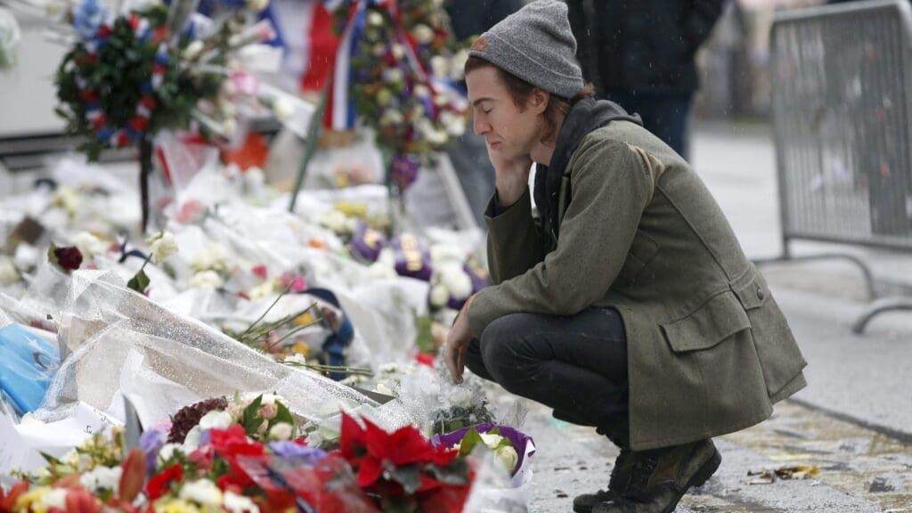 Julian Dorio, drummer of the US band Eagles of Death Metal who performed at the Bataclan theatre on the night of the Islamist massacre, pays his respects to the victims on 8 December 2015.