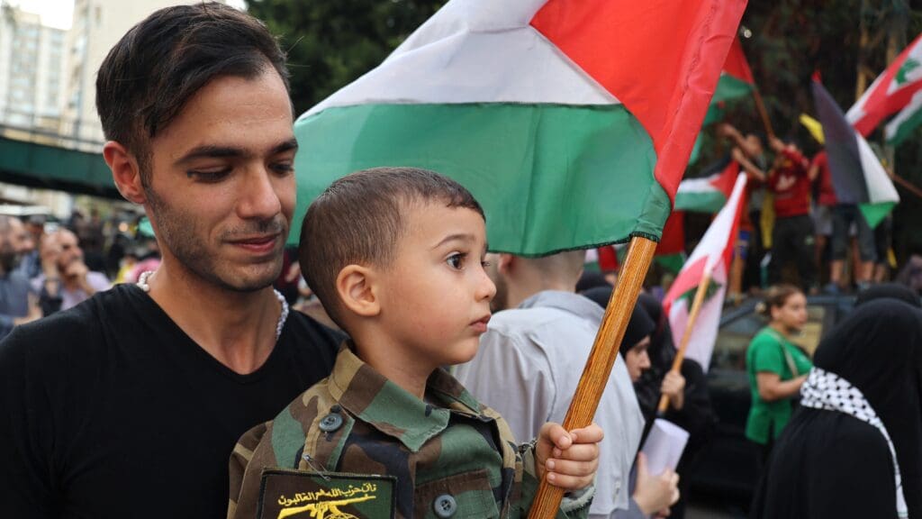 Hezbollah supporters protest in solidarity with Gaza Palestinians in Beirut, Lebanon on 27 October 2023.