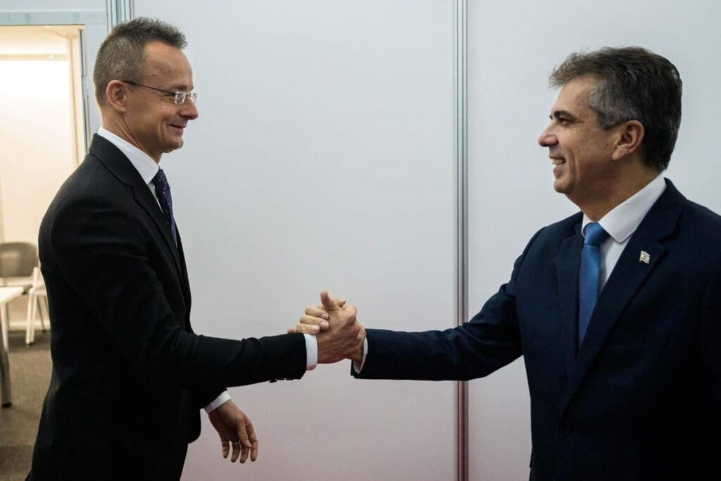 Péter Szijjártó (L) and Eli Cohen shake hands on 30 November in Skopje, North Macedonia.