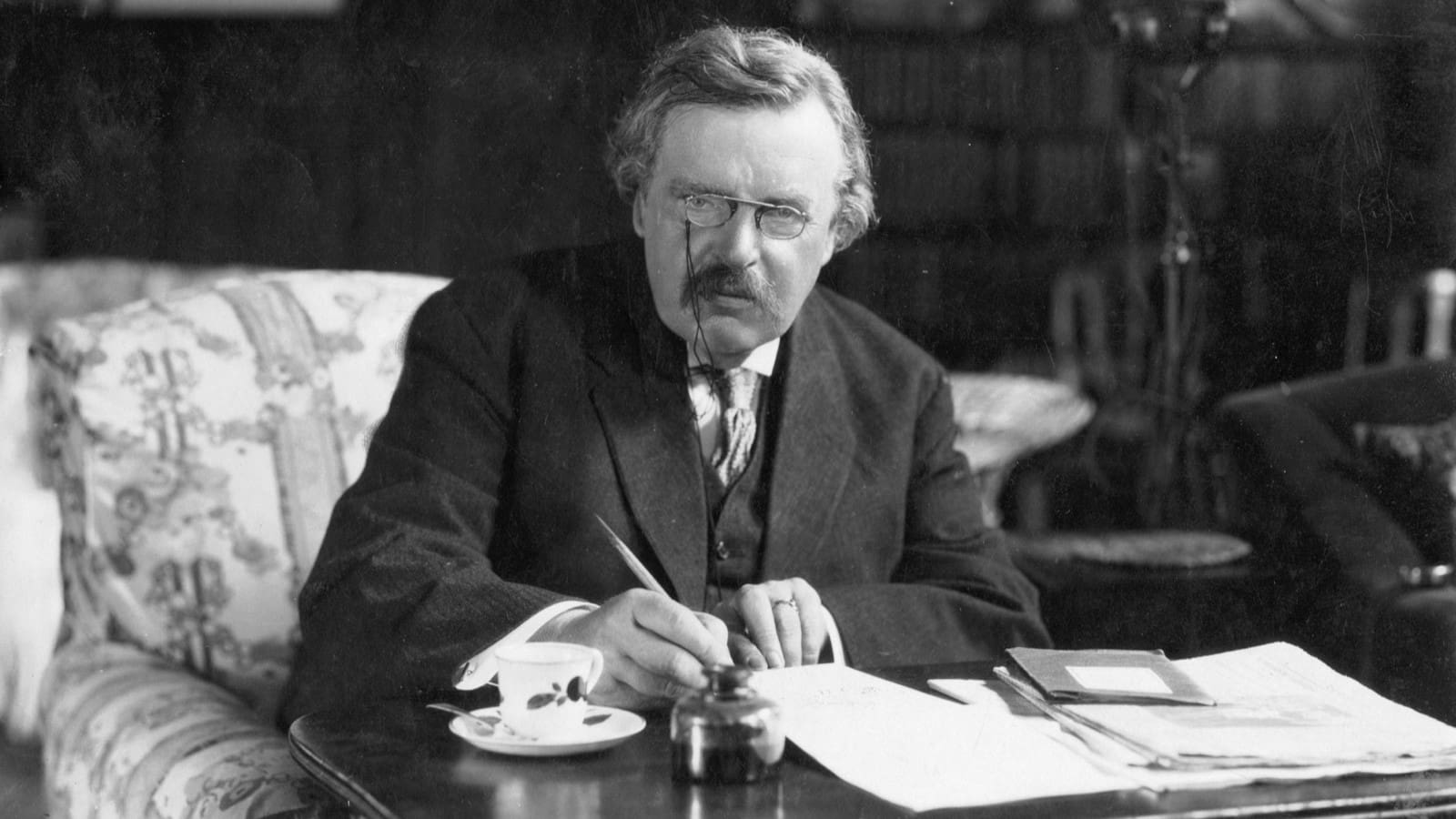 G. K. Chesterton at work (unknown author, prior to 1928).