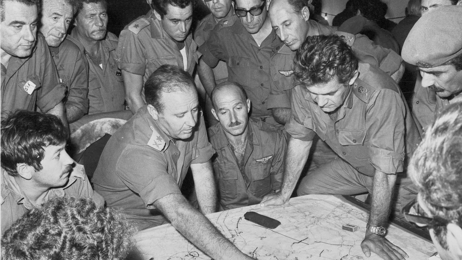 Members of the Israeli Defence Staff in a meeting during the Yom Kippur War. Brigadier General Yekutiel Adam, deputy commander of Northern Command (with a moustache, wearing an army beret) was later killed in Lebanon.