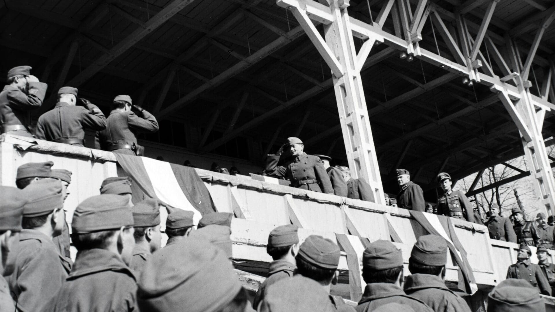 The marking of the withdrawal of Hungarian troops from the Ukrainian theatre of operations in the German Stadium (today Valeriy Lobanovskyi Stadium) in Kiev in 1943. Gusztáv Jány is at the centre of the photo saluting.