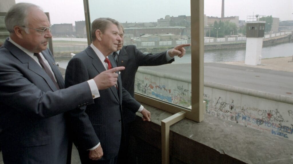 German Chancellor Helmut Kohl and US President Ronald Reagan at the Berlin Wall on 6 December 1987.