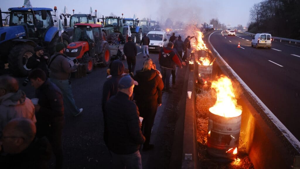 French farmers protesting against the government’s agricultural policy block a motorway near Ableiges, north of Paris, on 26 January 2024.