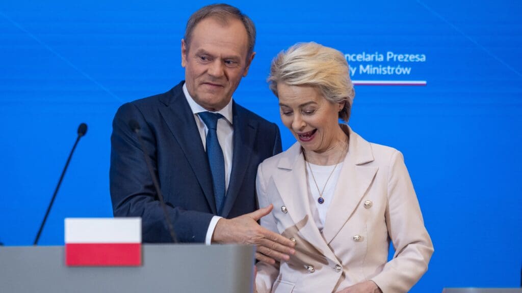 Polish Prime Minister Donald Tusk (L) and European Commission president Ursula Von der Leyen share a laugh as they leave the press conference after their meeting at the Polish Prime Minister's office in Warsaw on 23 February 2024.