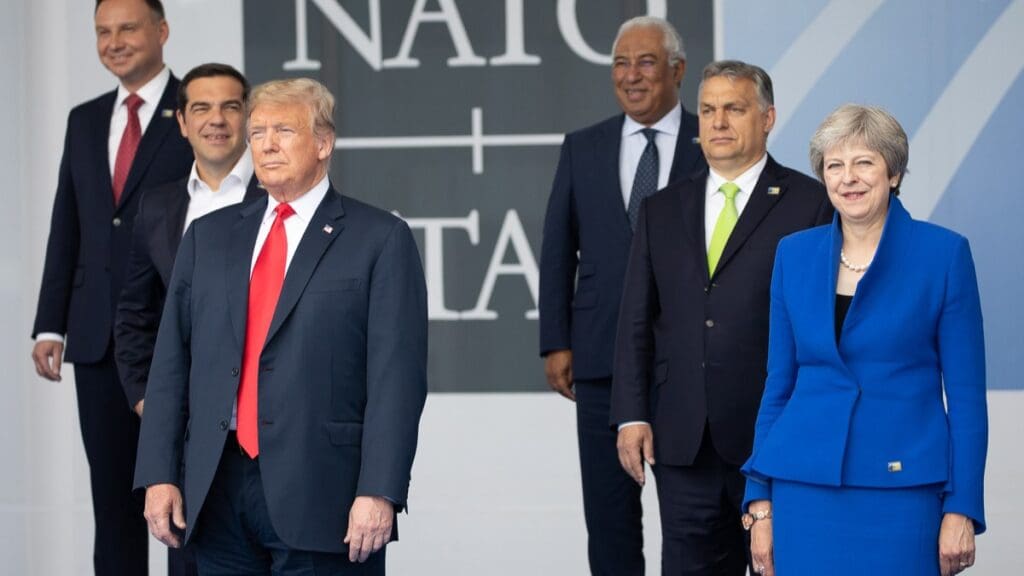 President Donald Trump with other NATO leaders poses for a family photo on 11 July 2018. Viktor Orbán can be seen behind the President to the right.