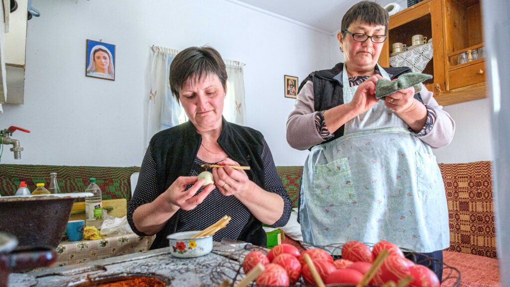 Women paint eggs on Good Friday in Hidegség Pataka/Gyimesközéplok in Transylvania on 15 April 2022.