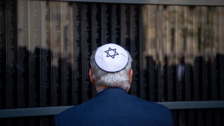 A commemorator at the Memorial Wall of Victims at the Budapest Holocaust Memorial Centre on 16 April 2023