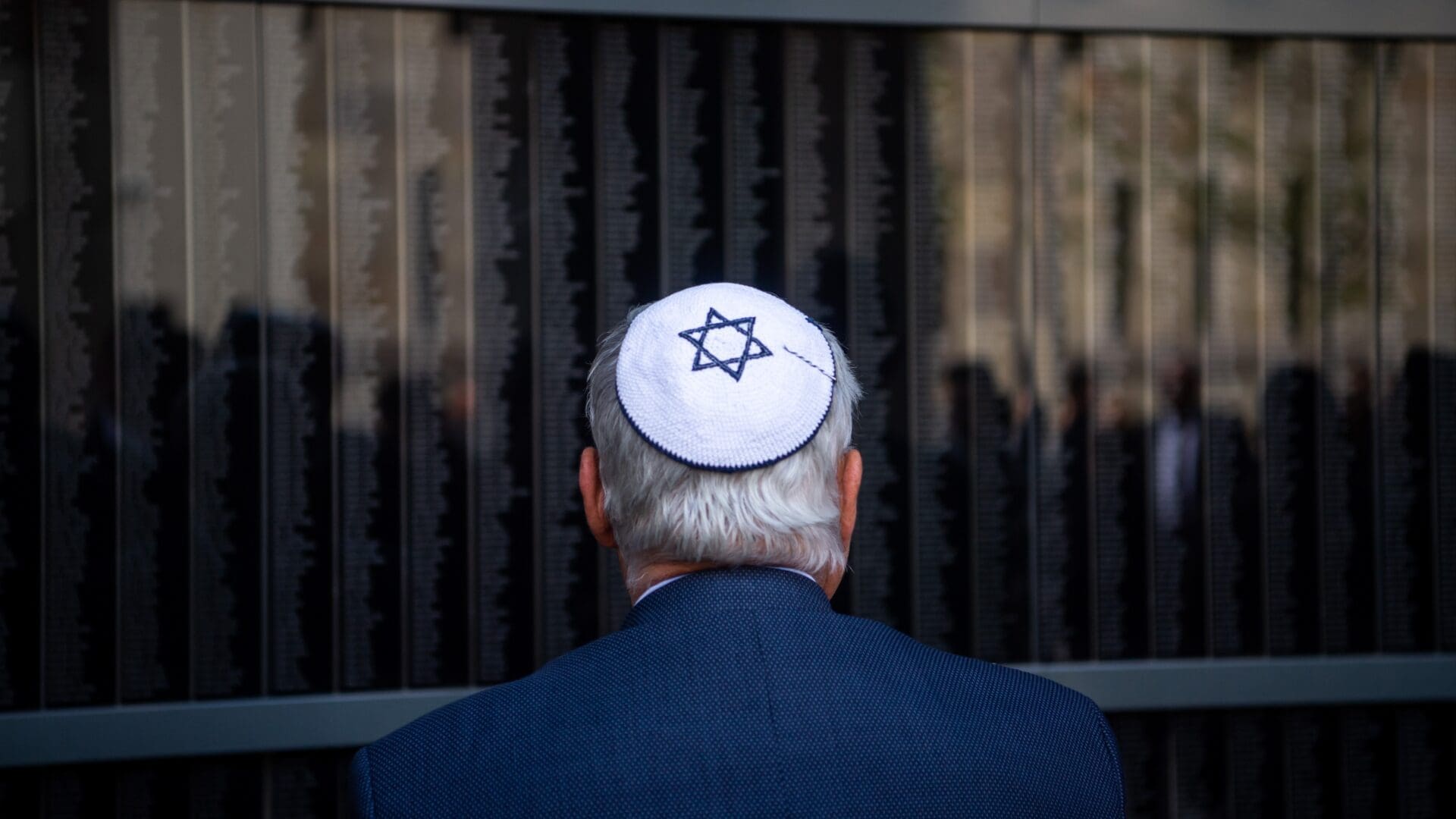 A commemorator at the Memorial Wall of Victims at the Budapest Holocaust Memorial Centre on 16 April 2023