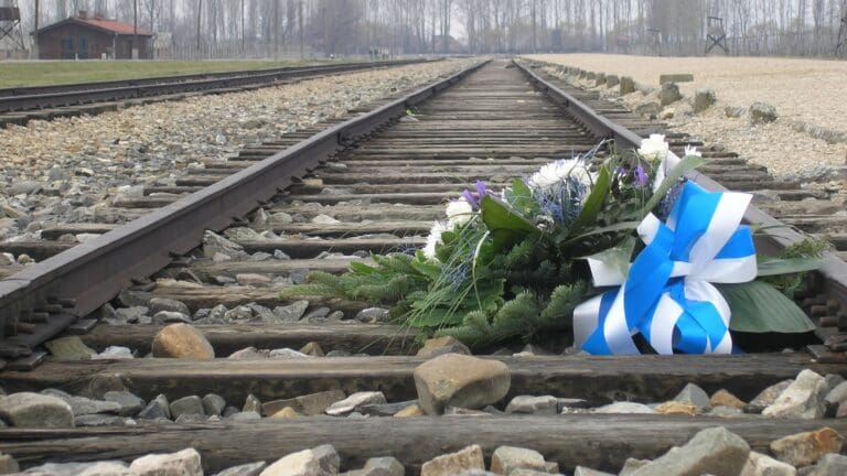 Flowers of remembrance laid on the railway tracks at the former Auschwitz concentration camp on 10 March 2007