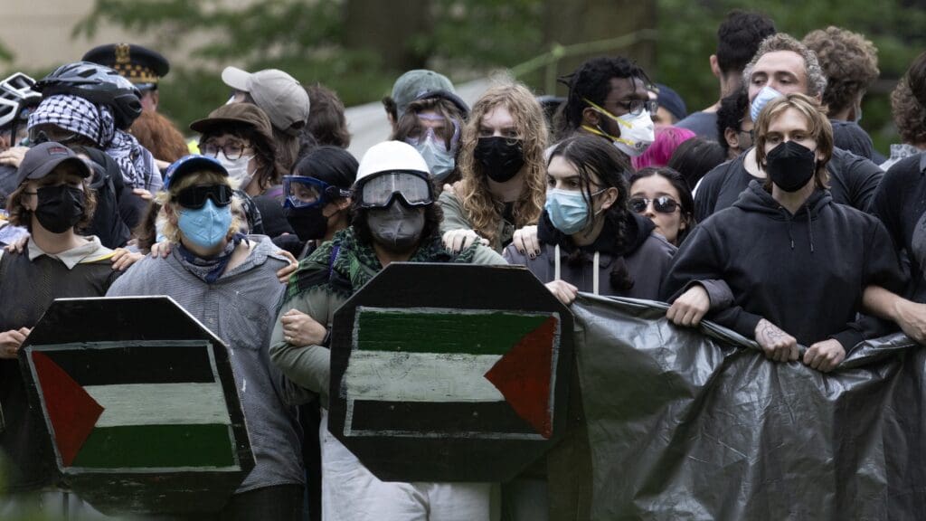 Demonstrators prepare to confront police who are planning to break up an encampment on the campus of the Art Institute of Chicago after students established a protest encampment on the grounds on May 04, 2024 in Chicago, Illinois.