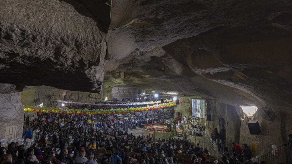 Egyptian Copts attend the Christmas mass at the Saint Simon Monastery, also known as the Cave Church, in the Mokattam mountain of Egypt's capital Cairo on January 6, 2023.