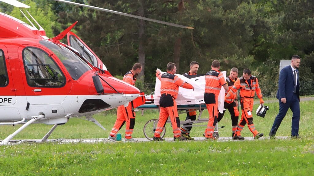 Picture taken on May 15, 2024 shows Slovak Prime Minister Robert Fico being transported from a helicopter by medics and his security detail to the hospital in Banska Bystrica, Slovakia where he is to be treated after he had been shot "multiple times" .