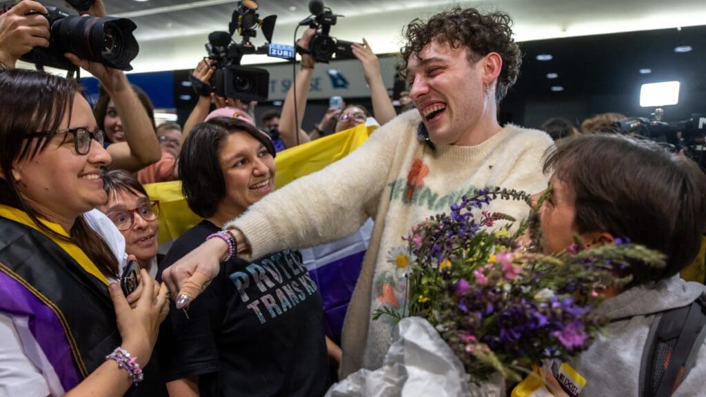Swiss singer Nemo who won the final of the 68th Eurovision Song Contest (ESC) 2024 with the song "The Code" is welcomed by supporters after landing at Zurich Airport on late May 12, 2024.