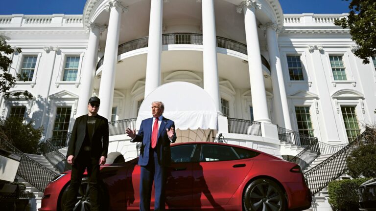 US President Donald Trump and Tesla CEO Elon Musk speak to the press as they stand next to a Tesla vehicle on the South Portico of the White House in Washington, DC, USA, 11 March 2025