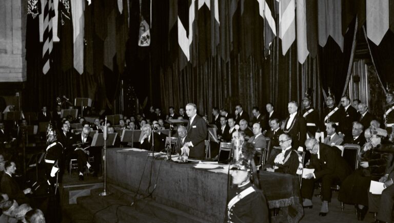 President of the Provisional Government of the French Republic Georges Bidault (standing) delivers a speech with Director-General of UNESCO Sir Julian Huxley (R) at the UNESCO conference in Paris, France, 19 November 1946