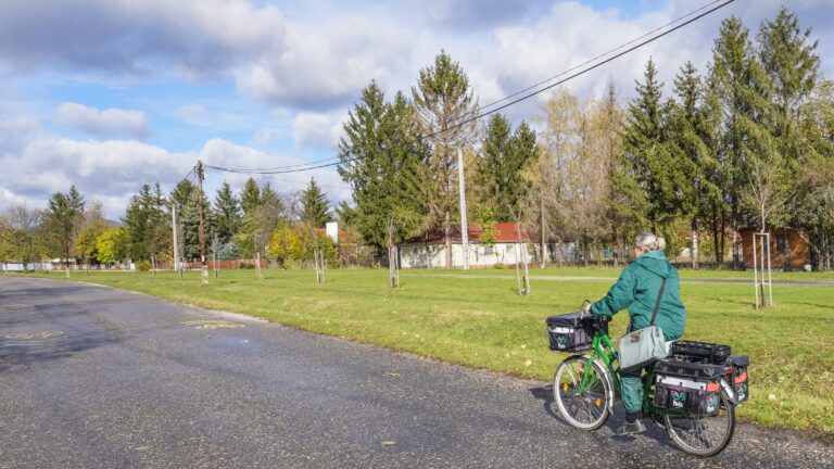 A woman postman is delivering letters on an electric bicycle with panniers adapted to transport parcels as she makes her way to mailboxes in Bogacs, Hungary, on November 8. (Photo by Michal Fludra/NurPhoto) (Photo by Michal Fludra / NurPhoto / NurPhoto via AFP)