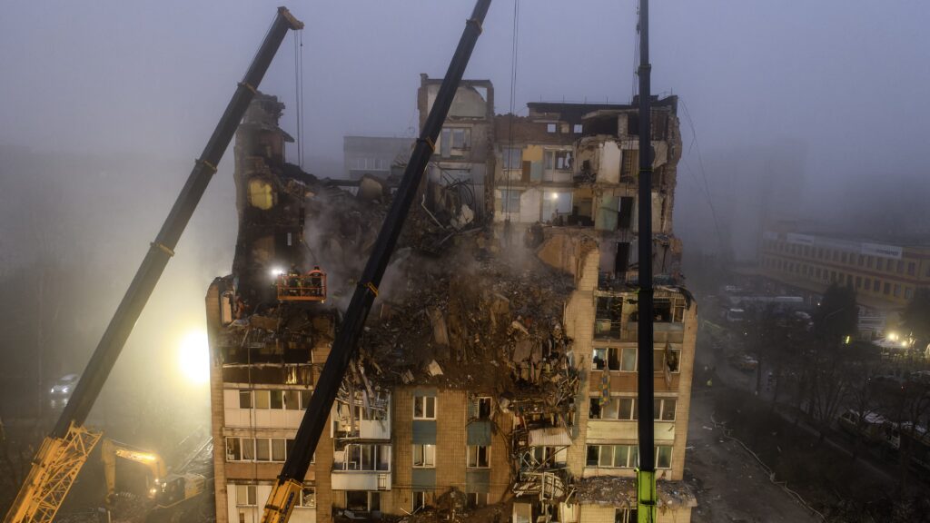 Ukrainian rescue personnel operate at the site of a heavily damaged residential building following Russian air strike in the city of Ternopil, on November 20, 2025