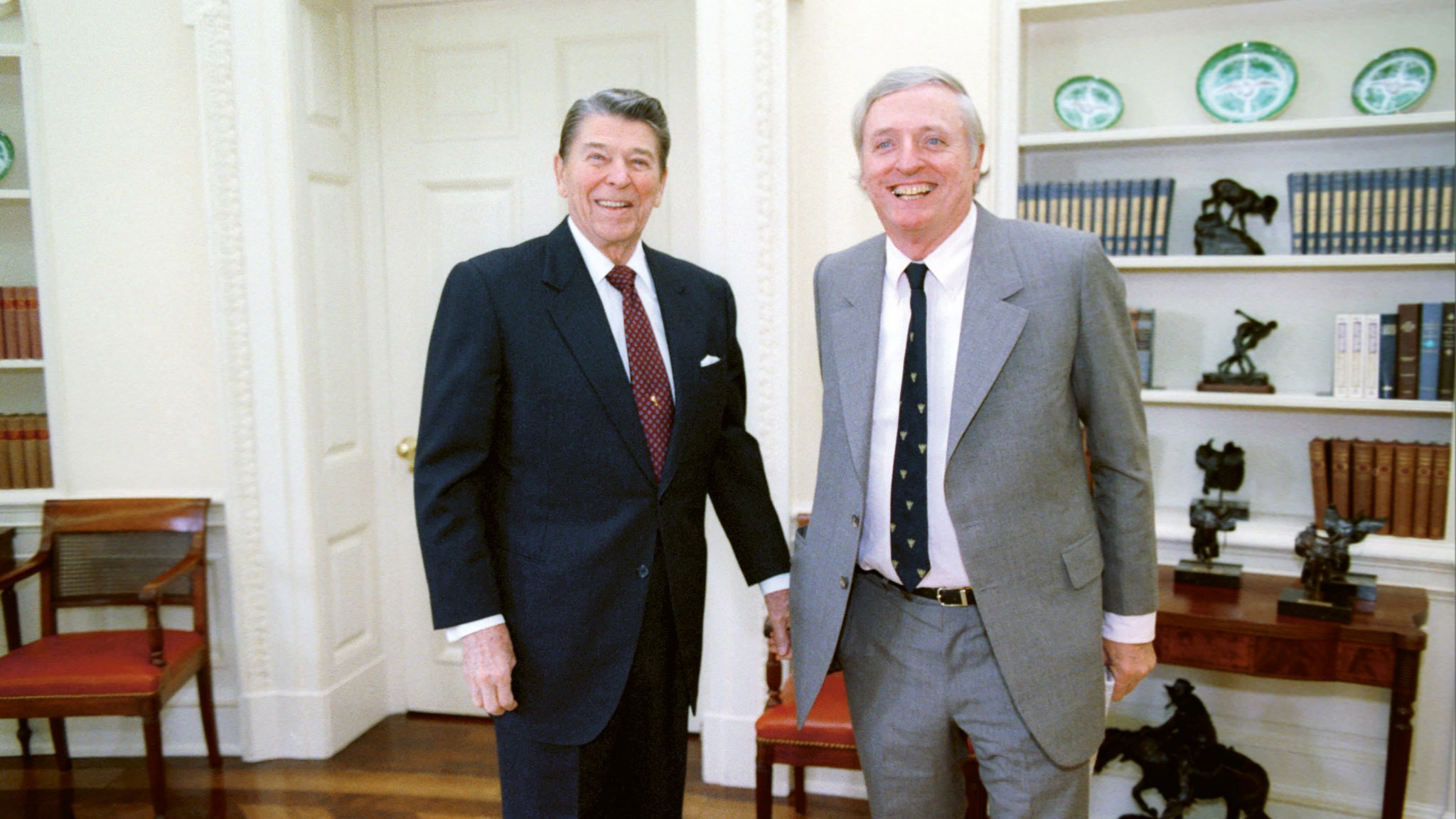 President Ronald Reagan (L) with William F. Buckley in the Oval Office of the White House in Washington, DC, on 21 January 1988