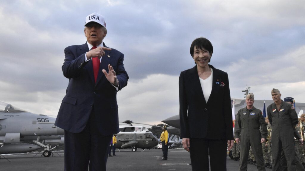 U.S. President Donald Trump (L) and Japanese Prime Minister Sanae Takaichi arrive at the nuclear-powered aircraft carrier USS George Washington (CVN-73) in Yokosuka City, Kanagawa Prefecture, Japan, on October 28, 2025