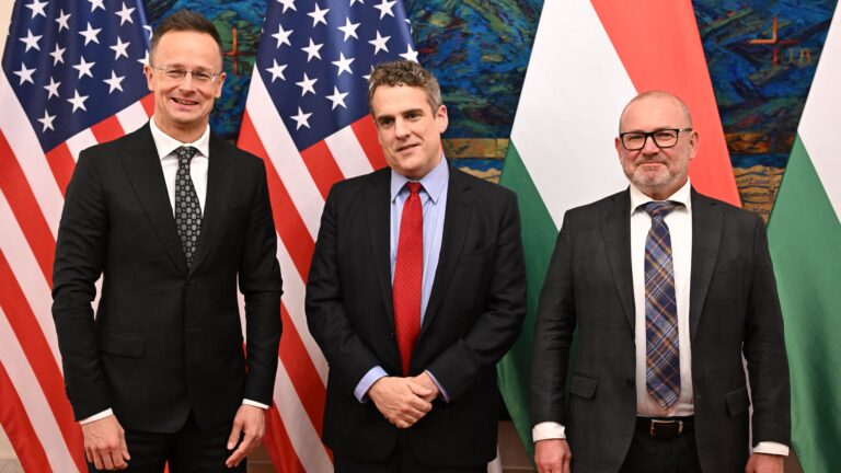 US Deputy Secretary of Energy Department James Danly (C) and Hungary's Foreign and Trade Minister Peter Szijjarto (L) and Hungary's Minister of Energy Csaba Lantos (R) pose for a picture prior to their official talks on December 16, 2025, in the ministry building in Budapest, Hungary.