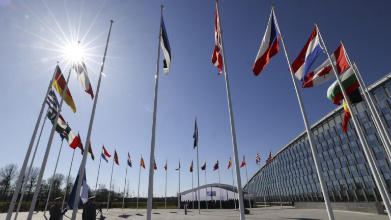Flags of NATO member countries outside the NATO headquarters in Brussels.